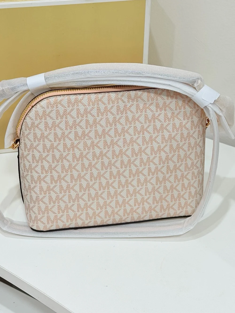 Michael Kors Jet Set Travel Medium Logo Dome Crossbody Bag in the powder blush